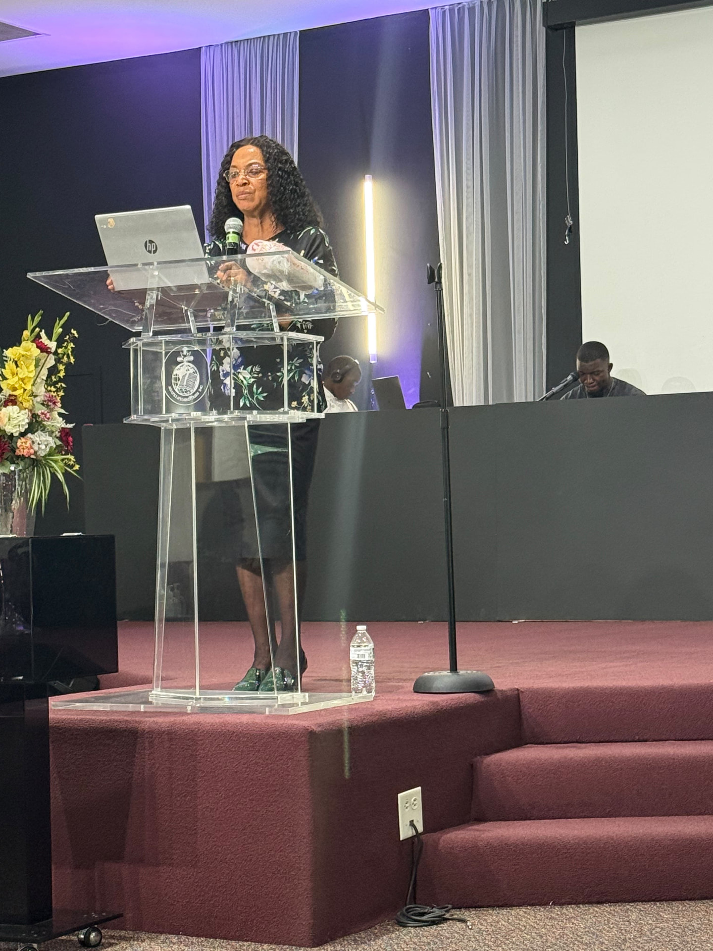 Dr. Cynthia Sowah leading a service