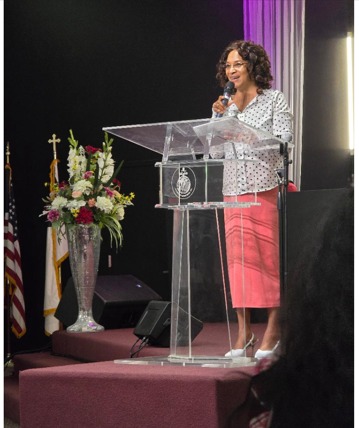 Dr. Cynthia Sowah ministering at the pulpit
