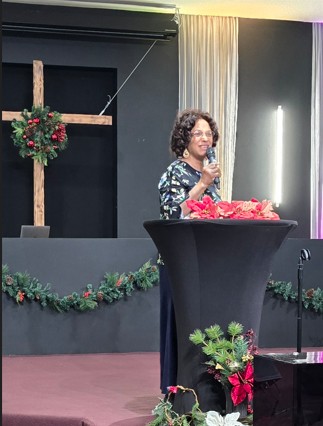 Dr. Cynthia Sowah leading a Christmas service